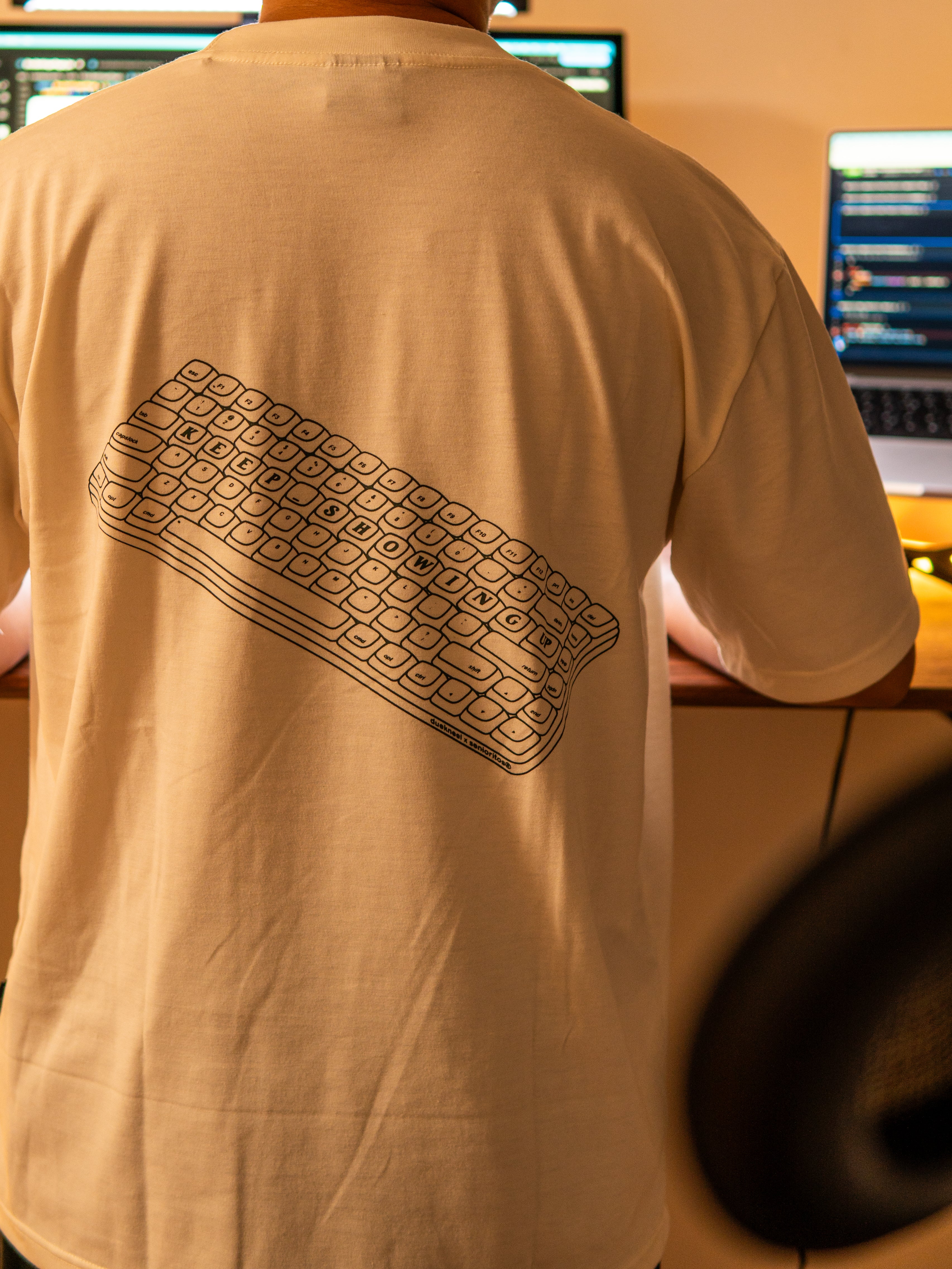 KEEP SHOWING UP REGULAR TEE | CREAM | DUEKNEELxSENIORITOS® COLLABORATION