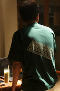 KEEP SHOWING UP REGULAR TEE | DARK GREEN | DUEKNEELxSENIORITOS® COLLABORATION